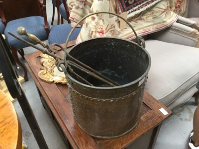 Lot 1027 - Copper and brass fire bucket with various irons