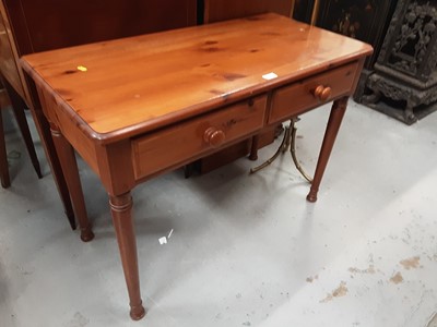 Lot 897 - Pine two drawer table on turned legs