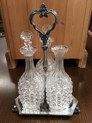 Lot 439 - Silver plated three bottle decanter stand