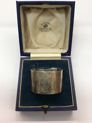 Lot 674 - Mappin & Webb silver napkin ring with engraved bunny decoration, in fitted case