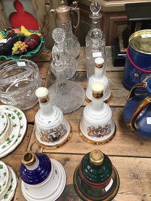 Lot 24 - A pair of commemorative porcelain decanters from Bell's Scotch Whiskey in celebration of royal weddings, together with three other Bell's decanters (three containing contents), four cut glass decan...