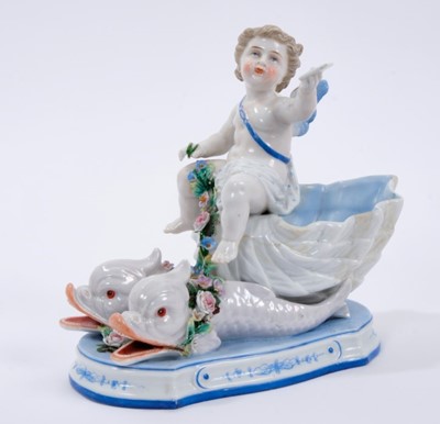 Lot 119 - KPM figure of a cherub on classical dolphins