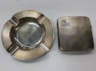 Lot 681 - Silver cigarette case with engine turned decoration, together with a silver ashtray (2)