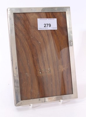 Lot 279 - George V silver photograph frame of plain rectangular form with wooden easel back(Detached but present) (Birmingham 1915) Sanders & Mackenzie. 17.8cm overall length.
