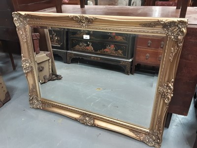 Lot 904 - Large bevelled wall mirror in ornate gilt frame