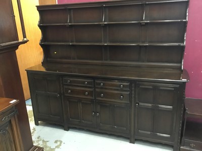 Lot 860 - Ercol dresser with raised back ,drawers and cupboards