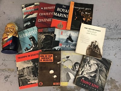 Lot 504 - Second World War information booklets including Bomber Command Continues, Roof Over Britain, Triumph in Disaster etc together with a Russian doll depicting Russian leaders