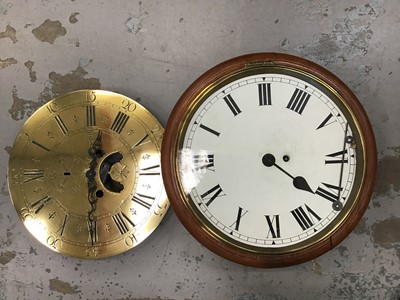 Lot 515 - A circular wall clock with pendulum and key plus additional brass dial face