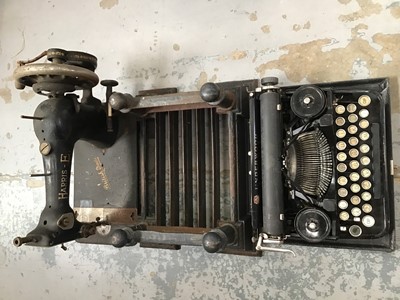 Lot 527 - Vintage Underwood manual typewriter, Harris sewing machine and metal foot scraper