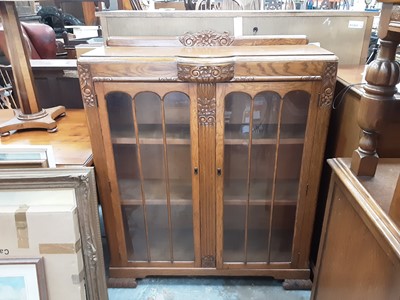 Lot 930 - 1930's carved oak china display cabinet with glazed doors