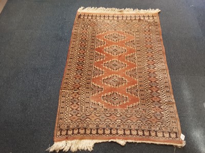 Lot 886 - Eastern rug with geometric decoration on pink ground 142cm x 96cm