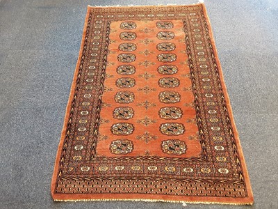 Lot 887 - Eastern rug with geometric decoration on pink ground 151cm x 98cm