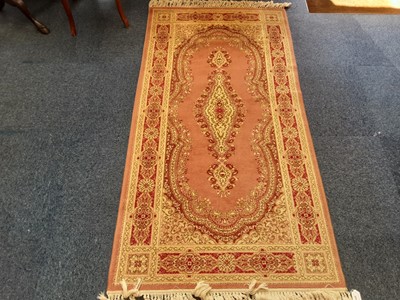Lot 889 - Super Keshan runner with geometric decoration on pink ground
