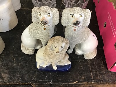 Lot 237 - Pair of Staffordshire Spaniels, together with another Staffordshire Spaniel (3)