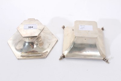 Lot 304 - George V silver capstan inkwell of hexagonal form, with  pen rest, hinged cover and clear glass ink reservoir (Sheffield 1914) Walker & Hall. Together with another inkwell of octagonal pyramid form...