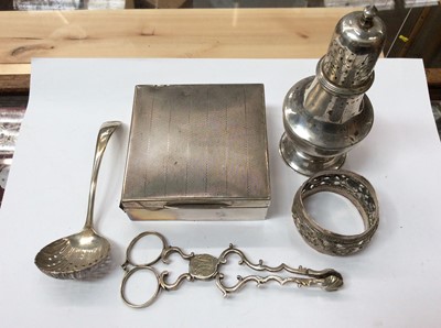 Lot 703 - Pair of Georgian silver tea tongs, together with a silver castor, silver cigarette box, sifter spoon and eastern white metal napkin ring