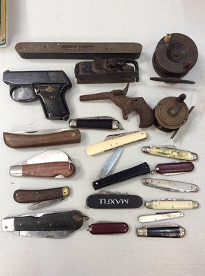 Lot 488 - Group of assorted pen knives, two old fishing reels, pistol and miniature plane