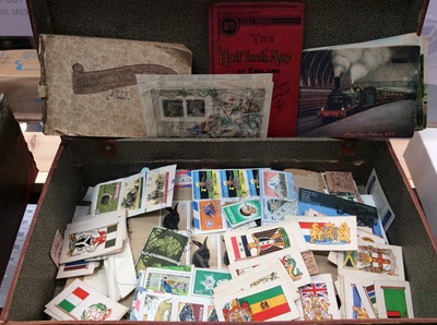 Lot 391 - Vintage leather suitcase containing various stamps, cigarette cards, vintage train postcards, old autograph book and Royal Mail presentation coin and tie