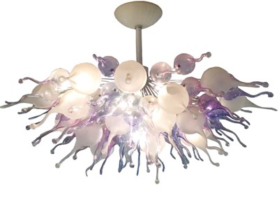 Lot 1525 - In the style of Dale Chihuly (American, born 1941), an impressive hand-blown sculptural glass ceiling light with purple, pink, white frosted and clear glass shades, approximately 100cm diameter. Th...