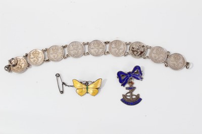 Lot 16 - Silver and yellow guilloché enamel butterfly brooch, silver and enamel Royal Navy sweetheart brooch and a silver three-penny coin bracelet