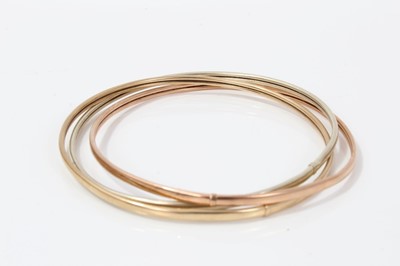 Lot 52 - Three colour gold Russian trio bangle