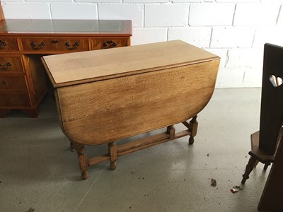 Lot 64 - 1920's oak drop leaf table on barley twist supports