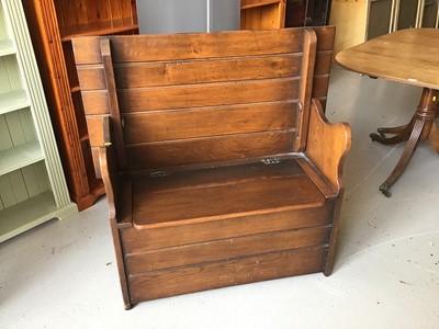 Lot 82 - 1930's oak monks bench with rising seat compartment and shaped arms H102.5cm W106.5cm D40cm