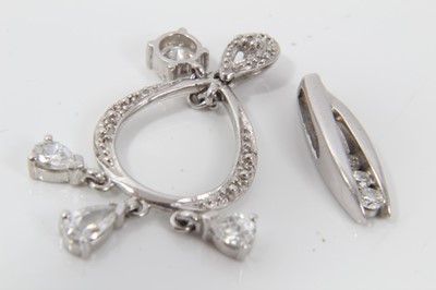 Lot 99 - Two 9ct white gold diamond and synthetic white stone pendants