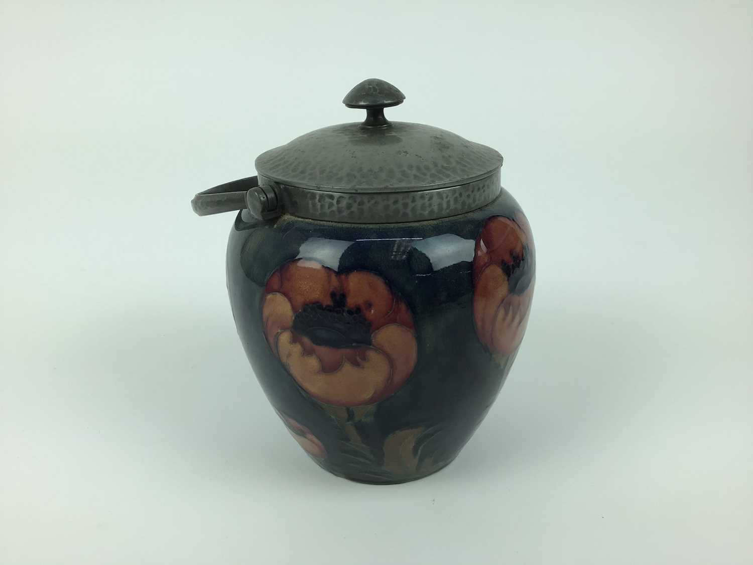 Lot 18 - Moorcroft pewter mounted biscuit barrel decorated in the poppy pattern on blue and green ground