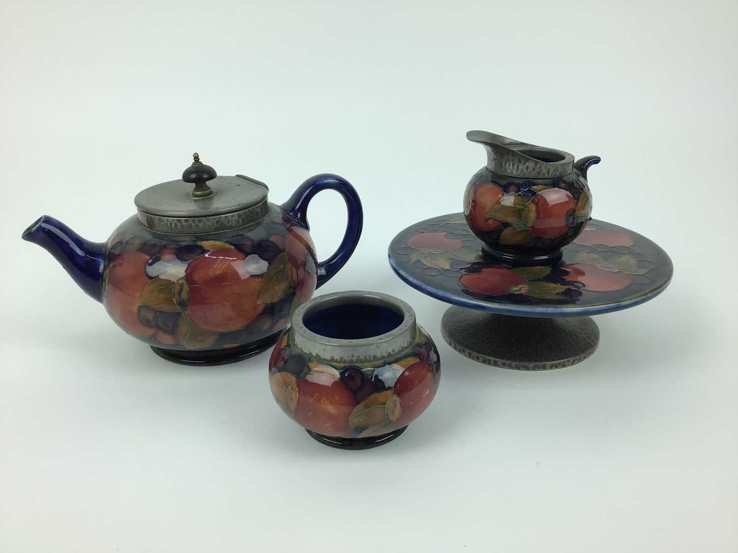 Lot 19 - Group of Moorcroft pomegranate pewter mounted tablewares - teapot, milk jug, Tarza, rosebowl