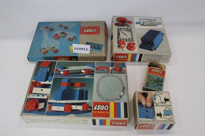 Lot 1509 - Vintage 1960s Lego system set in wooden box with assorted contents, Lego 314 boxed set, lego 111 boxed set, four wheel drive motor 100 boxed set, 101 battery case, large base plate 799 (6 items)