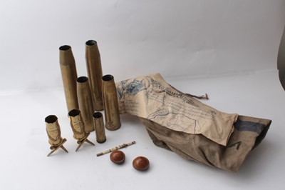 Lot 218 - Pair of First World War brass trench art vases marked Ypres, raised on bases constructed from bullets, together with other brass trench art vases, two carved nut Netsukes
