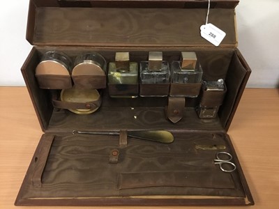 Lot 288 - Early 20th century silver mounted and glass toiletry set in original fitted case, together with another silver topped pot and other accessories