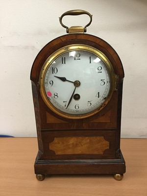 Lot 291 - Late 19th century inlaid mahogany mantel clock with circular white enamel dial, in dome topped case with brass carrying handle, on four brass ball feet, 26cm high