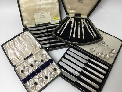Lot 294 - Two set of six silver coffee spoons, two set of six silver handled tea knives in fitted case and a nut cracker set in case