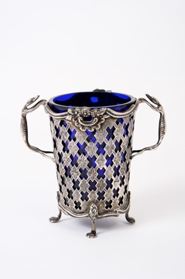 Lot 202 - Edwardian silver sugar basket with pierced decoration, scroll borders and twin handles modelled as Greyhounds