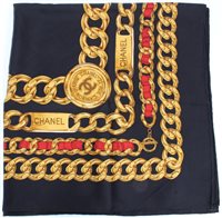 Lot 3092 - Authentic Chanel black silk scarf with gilt...
