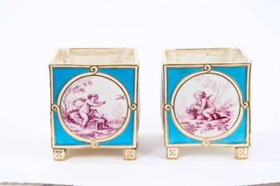 Lot 152 - Good pair of 18th/19th century porcelain cache pots, possibly Sèvres, of square form, decorated in puce with Boucher-style panels of cherubs, on a bleu celeste ground with gilt highlights, standin...