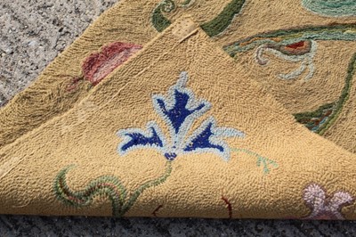 Lot 1390 - Two yellow ground embroidered rugs