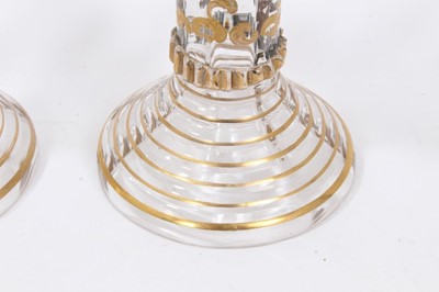 Lot 164 - Fine set of nine 19th century Bohemian glass goblets, the round bowls on hollow raspberry-prunted stems, on stepped feet, with raised gilt patterned decoration, 15.5cm height
