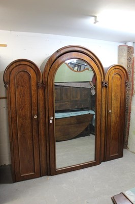 Lot 627 - Unusual Victorian mahogany triple wardrobe with triple domed top, central mirrored door