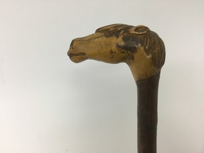 Lot 143 - Carved wood walking stick