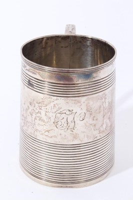 Lot 23 - George III silver christening mug of tapered form with ribbed bands and loop handle (London 1803), 5ozs