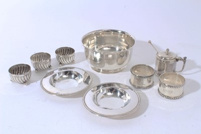 Lot 92 - George V silver sugar bowl of circular form with engraved inscription and flared rim, on a circular foot and (London 1922, together with three Victorian salts, two silver napkin ring