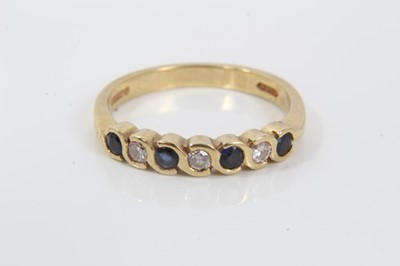 Lot 74 - 18ct gold diamond and sapphire seven stone half eternity ring
