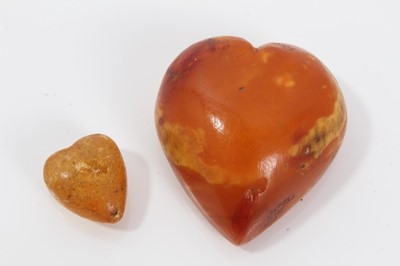 Lot 298 - Large Amber heart and one other (2)