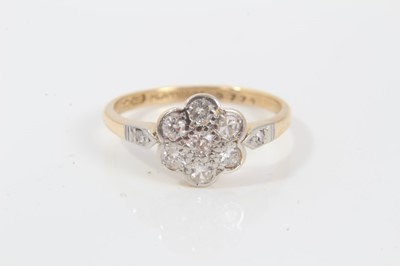 Lot 230 - 18ct gold dimoand flower head cluster ring