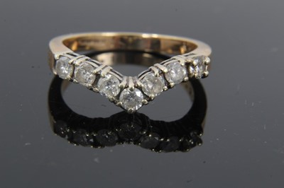 Lot 21 - 9ct gold diamond seven stone wishbone ring