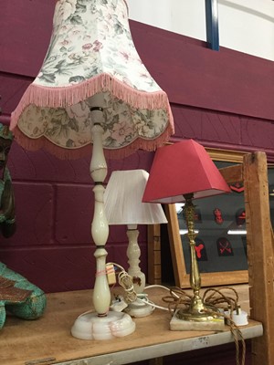 Lot 97 - Two Onyx table lamps together with a brass and Alabaster table lamp (3)