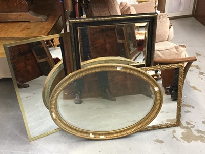 Lot 114 - Oval gilt framed bevelled wall mirror together with three other wall mirrors (4)